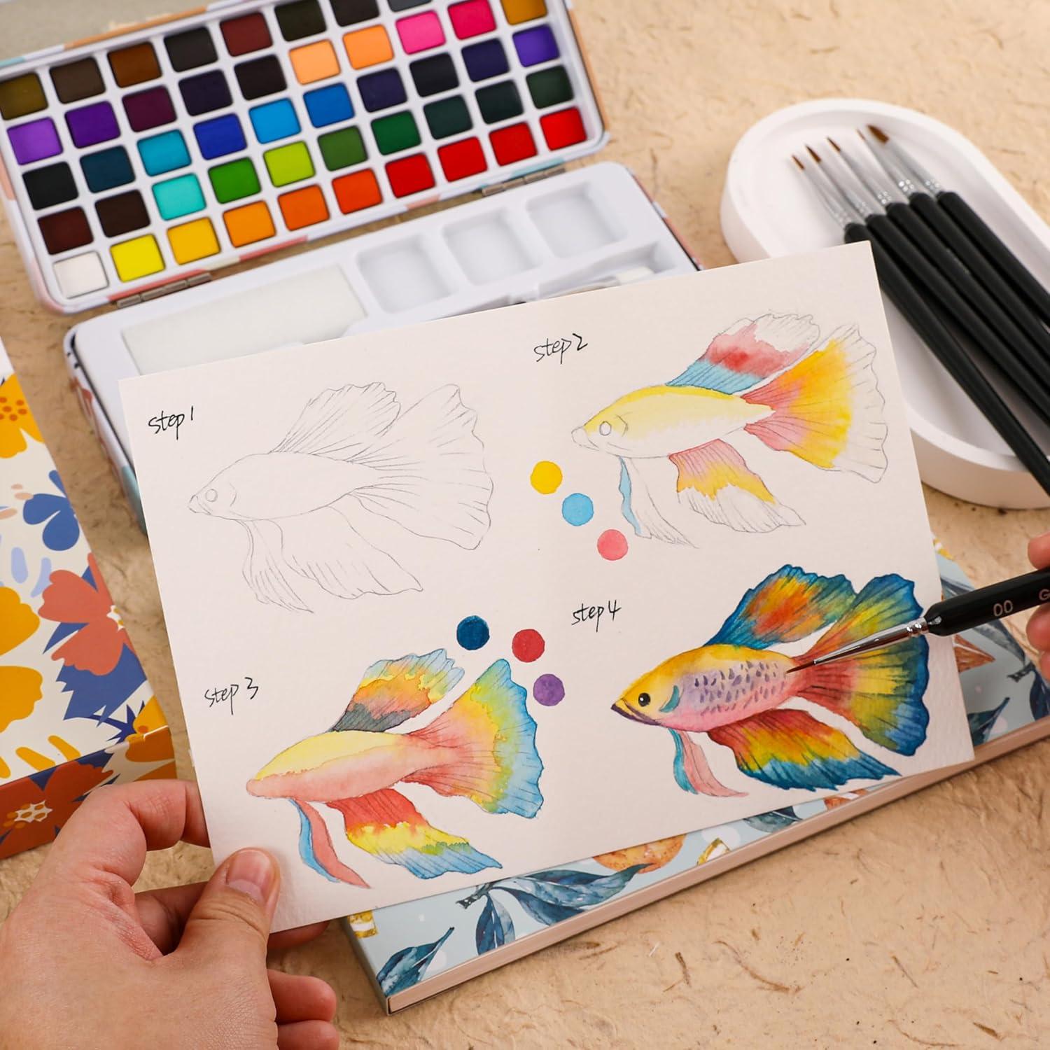 imageGrabie Watercolor Paint Set 50 Colors in Portable Box with Water Color Pallet Watercolor Papers and Brushes Ideal for Adults Artists and Hobbyists