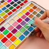 imageGrabie 50 Colors Watercolor Paint Set Detail Paint Brush Included Watercolor Paints Painting Sets Art Supplies for Painting Travel Watercolor Set Amateur Hobbyists100 Colors