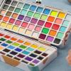 imageGrabie Watercolor Paint Set 100 Colors in Portable Box with Water Brush Pens Drawing Pencil Miniature Paint Brushes and Watercolor Papers Perfect Starter Kit for Painting