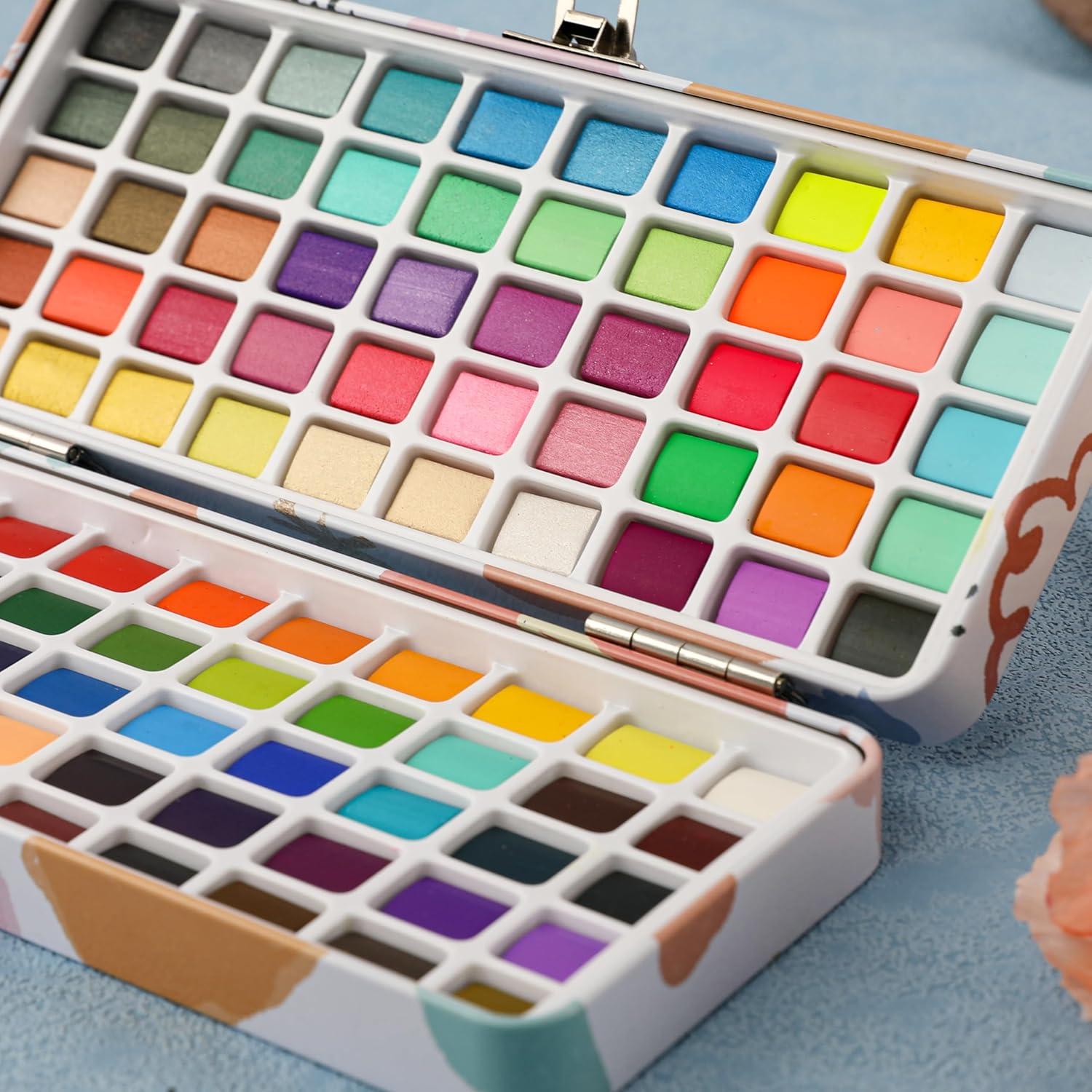imageGrabie Watercolor Paint Set 100 Colors in Portable Box with Water Brush Pens Drawing Pencil Professional Watercolor Brushes and Watercolor Papers Perfect Starter Kit for Painting