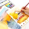 imageGrabie Watercolor Paint Set 100 Colors in Portable Box with Water Brush Pens Drawing Pencil Professional Watercolor Brushes and Watercolor Papers Perfect Starter Kit for Painting